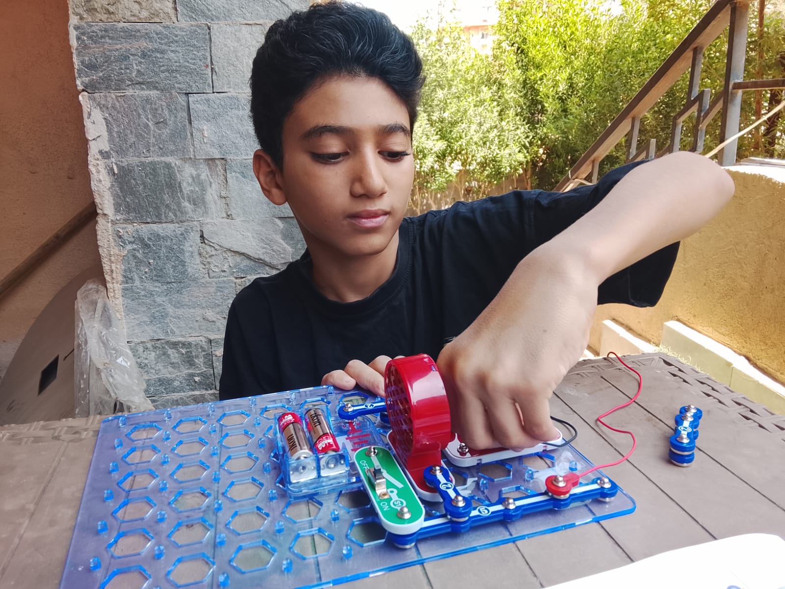 Student building a Snap Circuits project